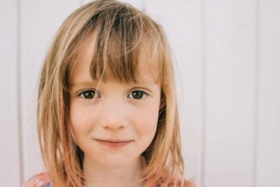 Candid close up portrait of young girl looking into the camera