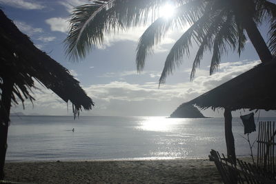 Scenic view of beach against sky during sunset