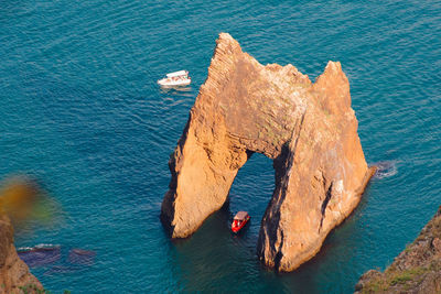 High angle view of rock formation in sea
