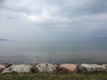 Scenic view of sea against cloudy sky
