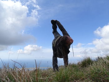 Full length of man on sea shore against sky