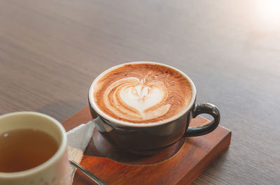 High angle view of cappuccino on table