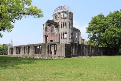 Old building on field against clear sky