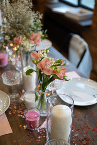 Flower vase on table in restaurant