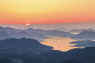 Scenic view of mountains against sky during sunset