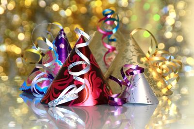 Close-up of colorful party hats on table