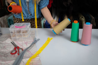 Midsection of woman working on table