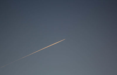 Low angle view of vapor trails in sky