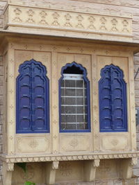 Low angle view of window of old building