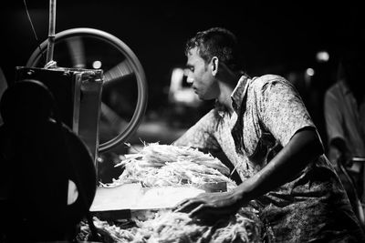 Side view of people looking at camera