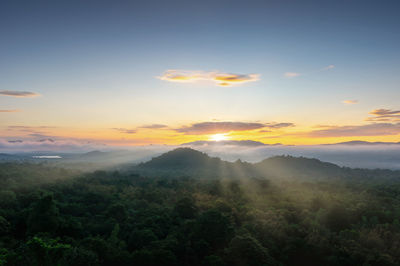 Scenic view of landscape against sky during sunset