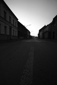 Road in city against clear sky