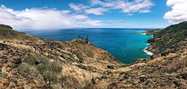 Scenic view of sea against cloudy sky