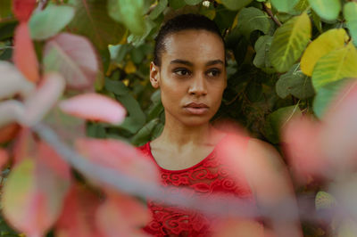 Portrait of young woman with leaves