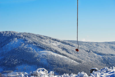 Scenic view of snow covered mountains against sky