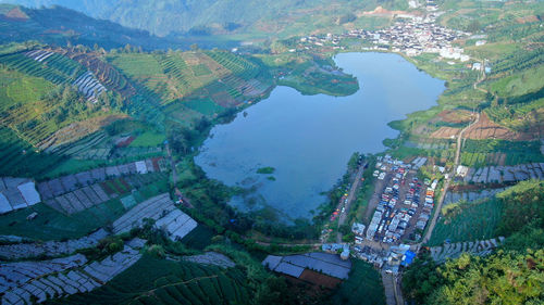 High angle view of buildings by sea