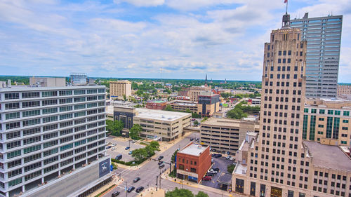 Buildings in city against sky