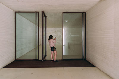 Boy standing in corridor