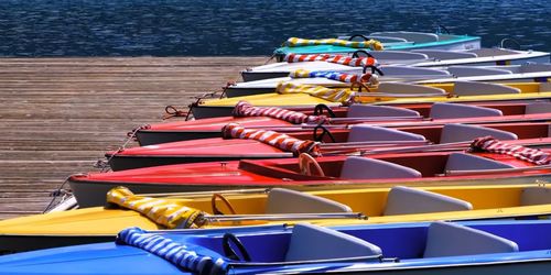 High angle view of boats moored at harbor