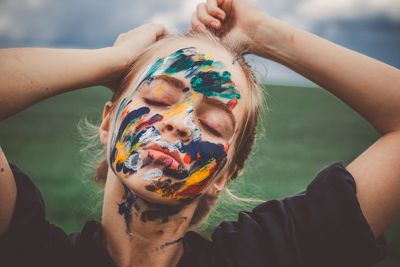 Close-up of young woman with face paint