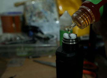 Close-up of liquid dripping in bottle