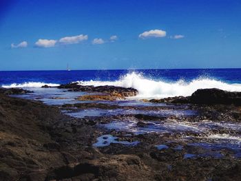 Waves splashing on rocks at beach