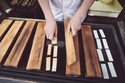 High angle view of man working on wood