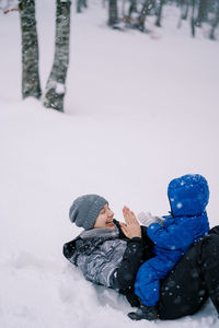 High angle view of woman skiing on snow