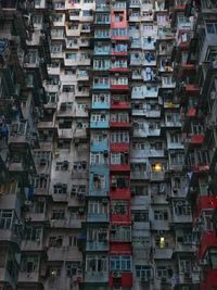 Facade of a residential building in hong kong showing small balconies and tight space