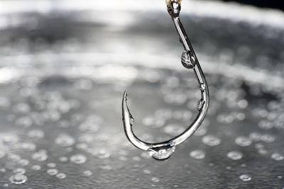 Close-up of water drops on metal