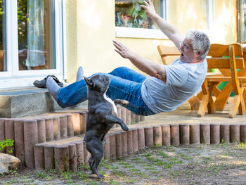 An elderly man has an accident and falls down a flight of stairs