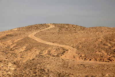 View of desert landscape against the sky