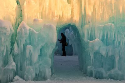 Full length of man standing in snow