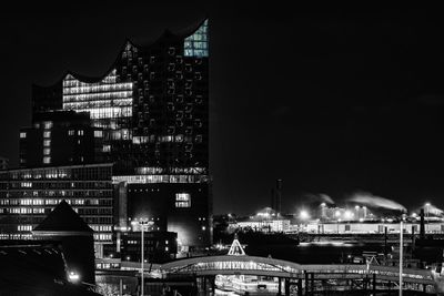 Illuminated building in city at night