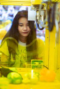 Portrait of young woman sitting at restaurant