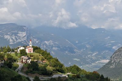 Panoramic view of buildings and mountains against sky