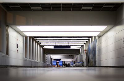 Man in illuminated corridor