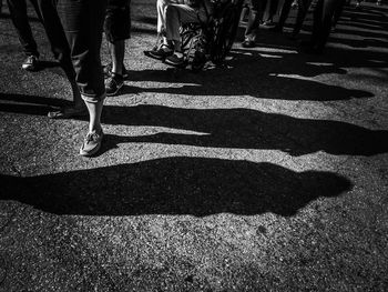 Shadow of person on road