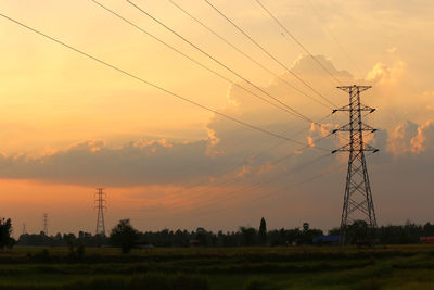 Scenic view of field against sky during sunset
