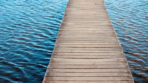 High angle view of wooden bridge in lake