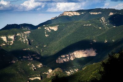 Aerial view of landscape against cloudy sky