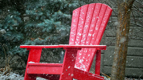 High angle view of wet red wood in winter