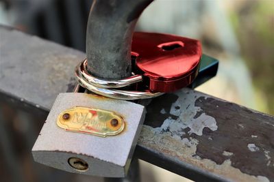 Close-up of love padlocks on rusty metal