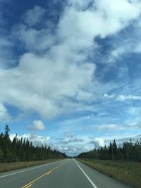 Empty road along countryside landscape