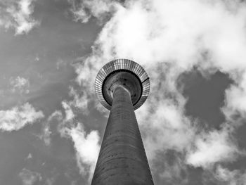 Low angle view of tower and building against sky