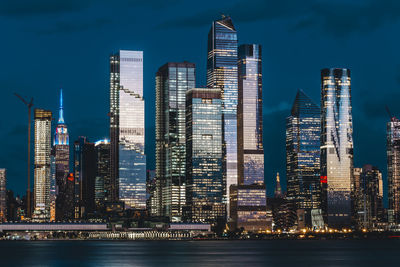 Illuminated buildings in city at night