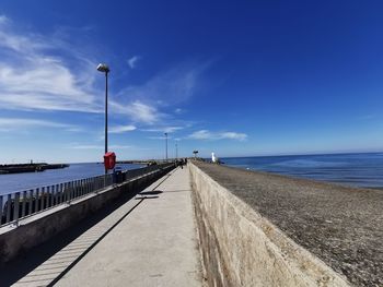 Scenic view of sea against blue sky