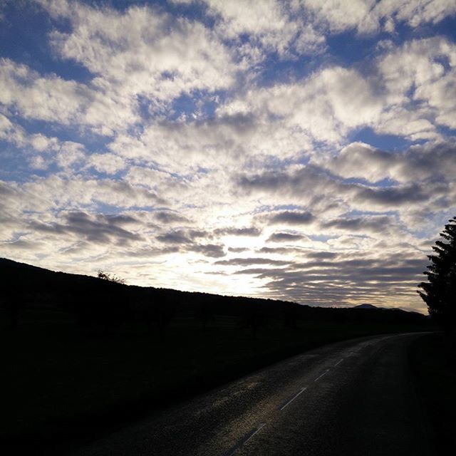 the way forward, sky, road, diminishing perspective, cloud - sky, transportation, vanishing point, sunset, cloudy, cloud, road marking, silhouette, tranquility, tranquil scene, landscape, nature, country road, long, street, scenics