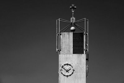 Low angle view of clock tower against clear sky