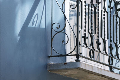 Metal railing on wall of building